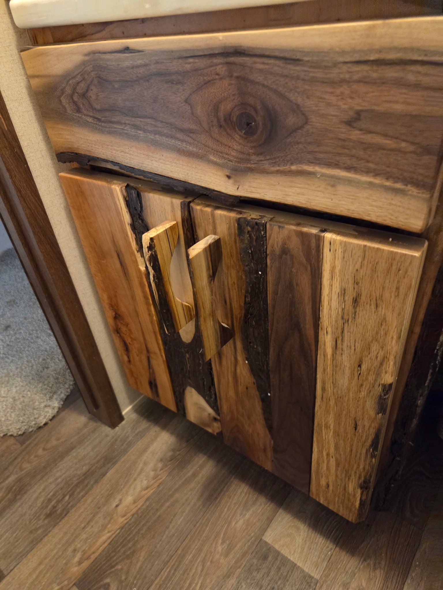 Double bathroom vanity in stained knotty alder with quartz top and linen tower